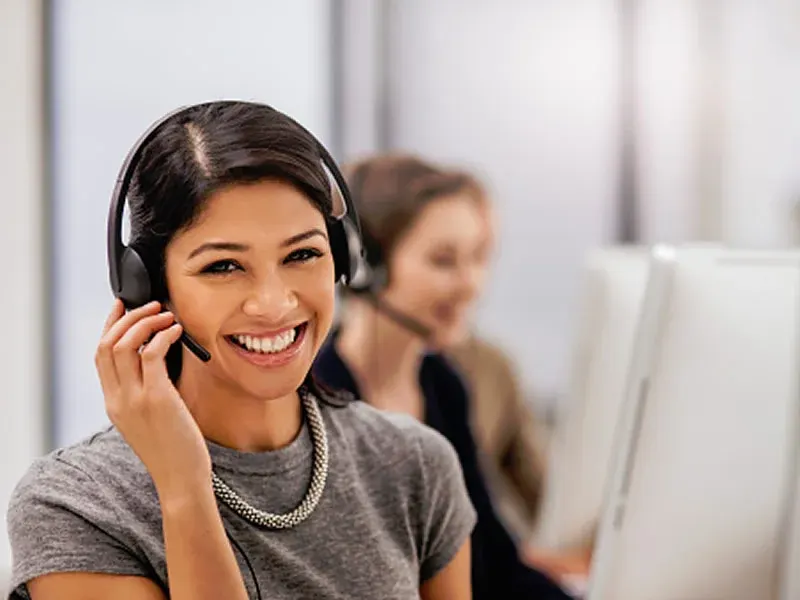 Two colleagues reviewing a customer workflow together